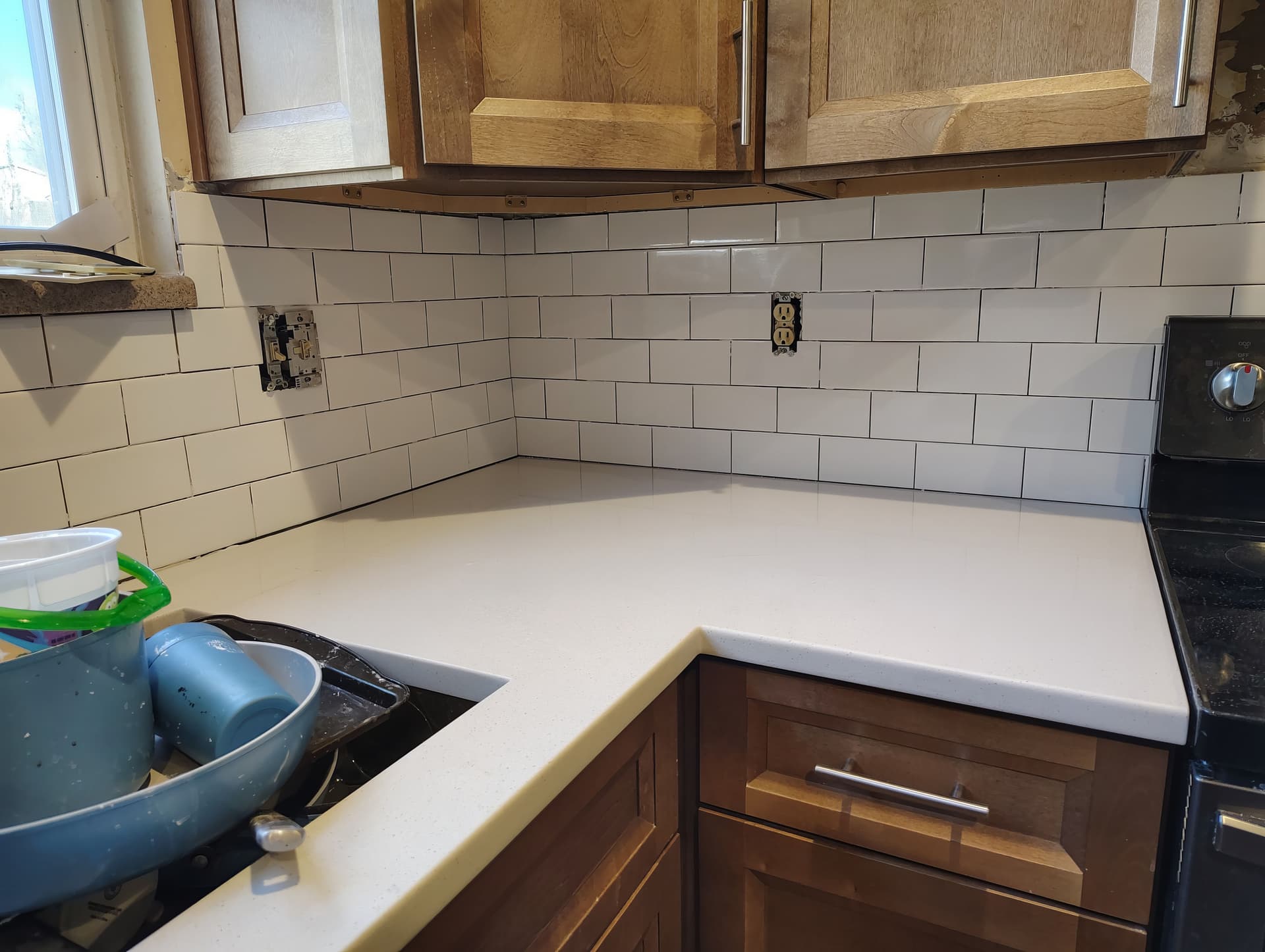 Tile backsplash and bathroom floor finish work